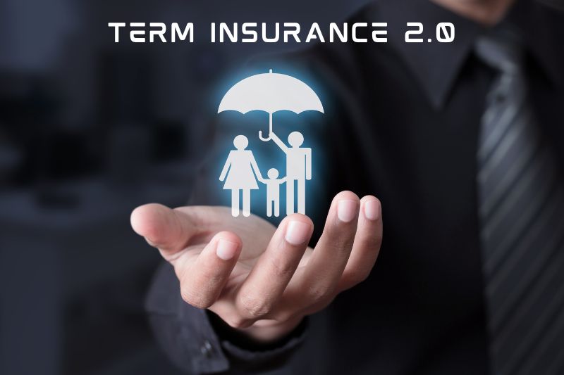 A businessman in a suit holds a glowing digital icon of a family under an umbrella, symbolizing protection, with the text “Term Insurance 2.0” displayed above.